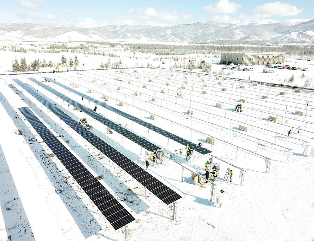 A snowy solar tracker project installation by Ampacity.