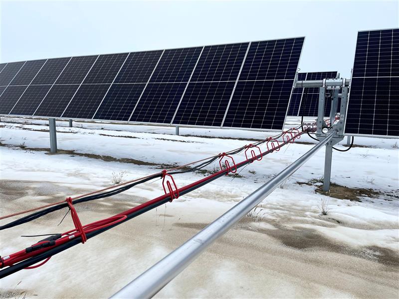 An above-ground wire management system for a solar tracker project.