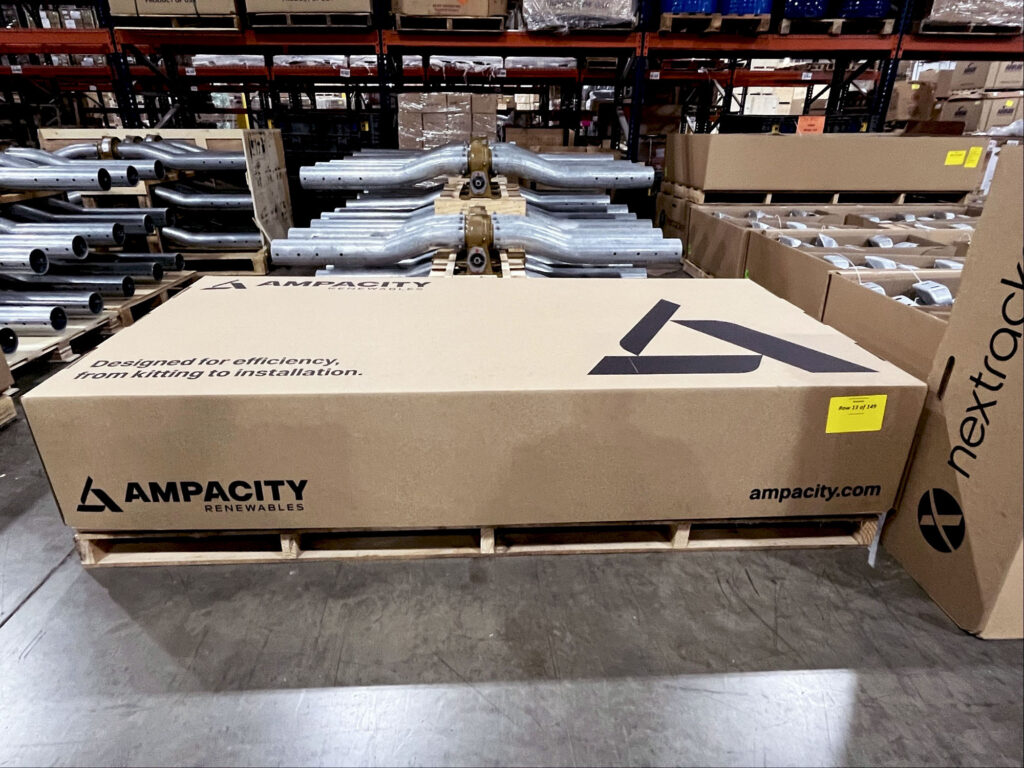 Ampacity warehouse with packaged project materials and kitted components prepared for shipment.